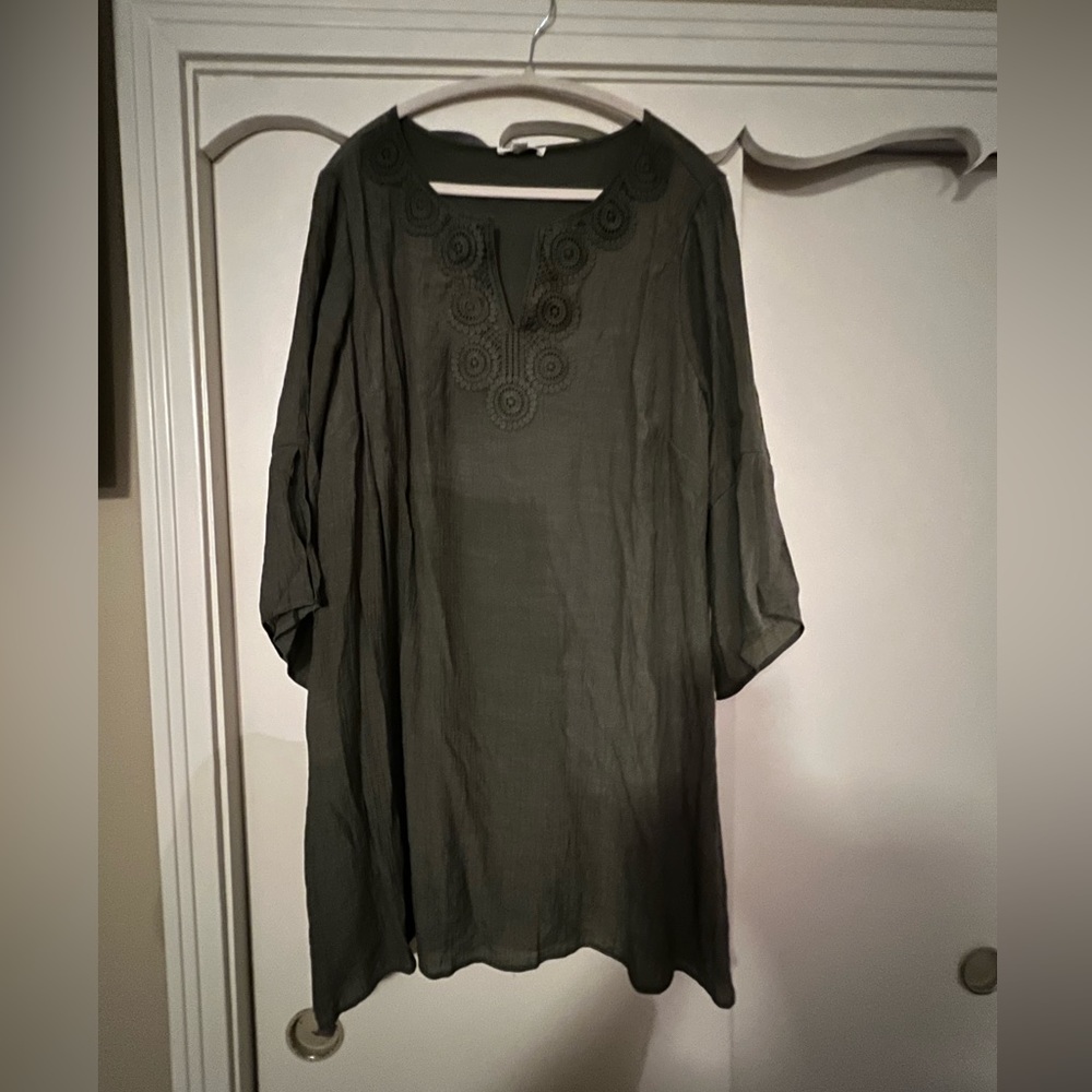 Olive green lined dress, embroidered around v- neck line.